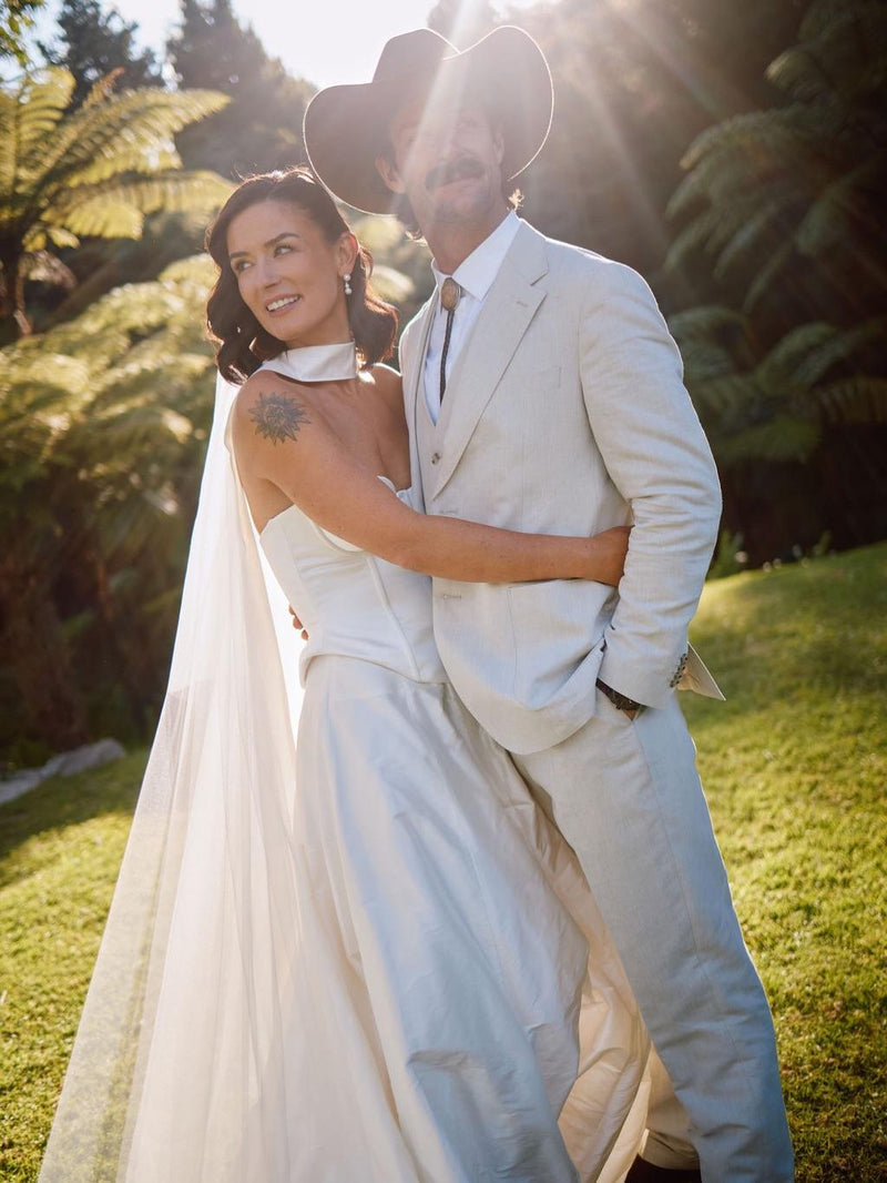 Aesha Scott and her husband Scott Dobson are married in New Zealand. Bespoke engagement ring and wedding ring designed by Layla Kaisi Collection.
